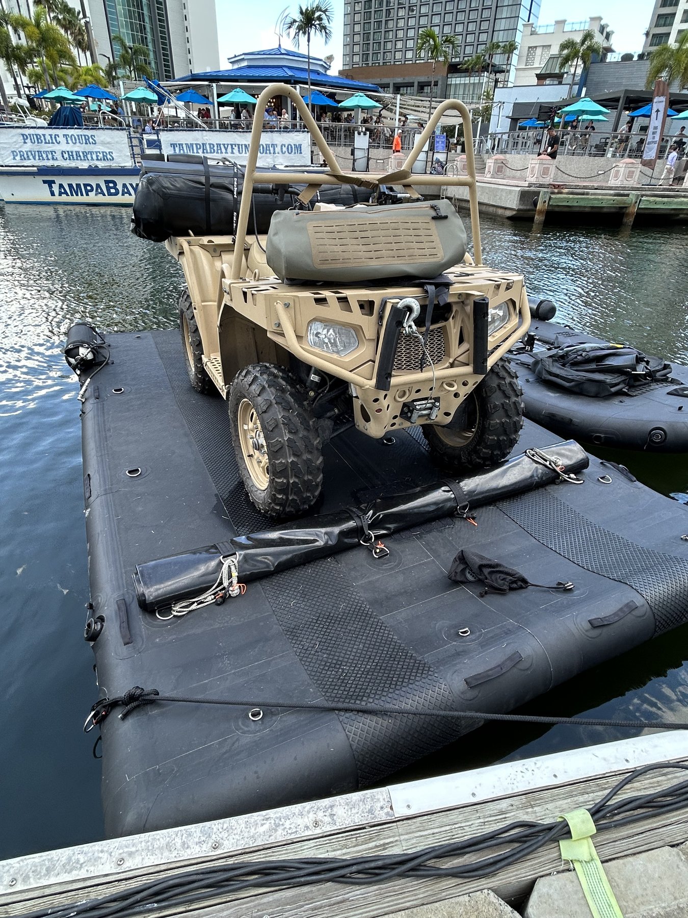 Tactical ATV on inflatable assault raft, Tampa Riverwalk, SOF Week 2026 — Photography by Kyle Edmund Hauser, Affairs of State